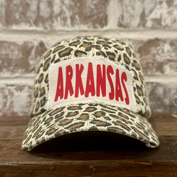 Arkansas hat by BohoGroove featuring a red ARKANSAS design on a Leopard vintage distressed snapback trucker hat.