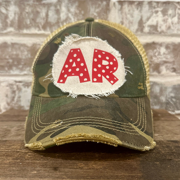 Arkansas Polka Dot hat by BohoGroove featuring a red polka dot AR design on a Camo vintage distressed snapback trucker hat.