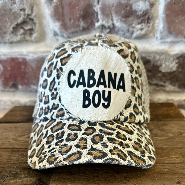 Cabana Boy hat by BohoGroove featuring black Cabana Boy lettering on a distressed off-white patch on a leopard vintage distressed snapback trucker hat.