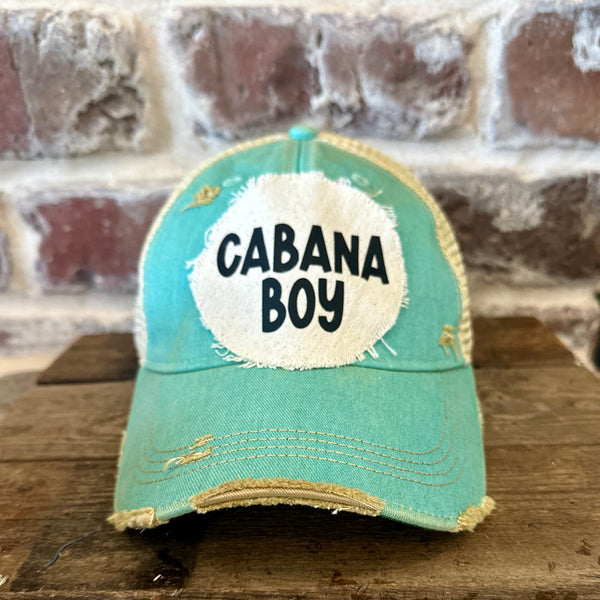Cabana Boy hat by BohoGroove featuring black Cabana Boy lettering on a distressed off-white patch on an ocean blue vintage distressed snapback trucker hat.