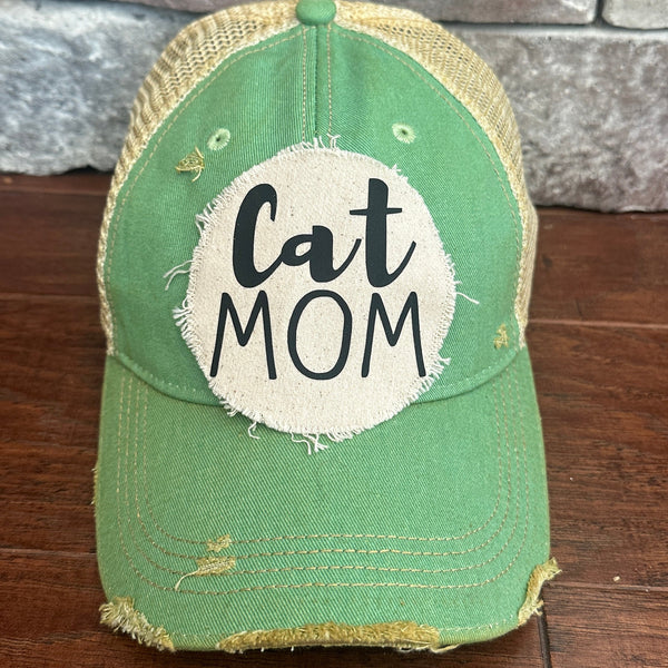 Cat Mom hat by BohoGroove with black Cat Mom lettering on a distressed off-white patch on a mint vintage distressed snapback.