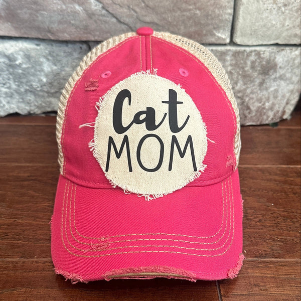 Cat Mom hat by BohoGroove with black Cat Mom lettering on a distressed off-white patch on a pink vintage distressed snapback.