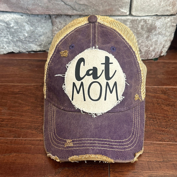 Cat Mom hat by BohoGroove with black Cat Mom lettering on a distressed off-white patch on a purple vintage distressed snapback.