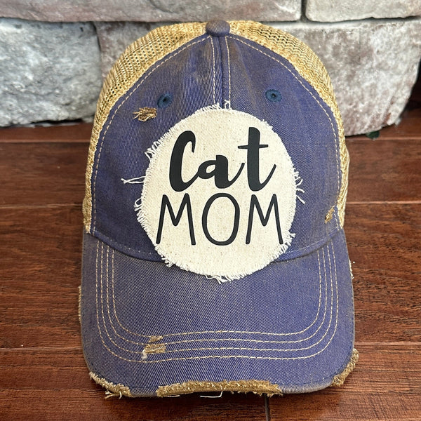 Cat Mom hat by BohoGroove with black Cat Mom lettering on a distressed off-white patch on a royal blue vintage distressed snapback.
