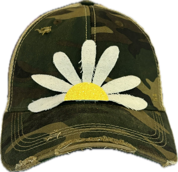 Daisy hat by BohoGroove featuring white daisy petals with a yellow glitter center on a camo vintage distressed snapback trucker hat.