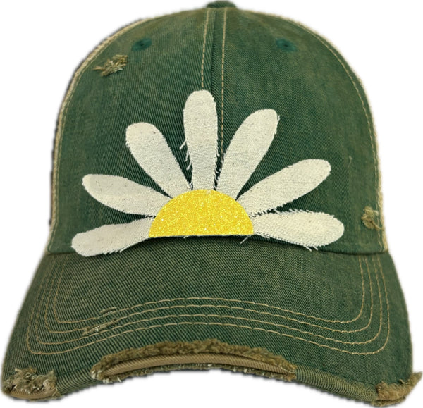 Daisy hat by BohoGroove featuring white daisy petals with a yellow glitter center on a green vintage distressed snapback trucker hat.