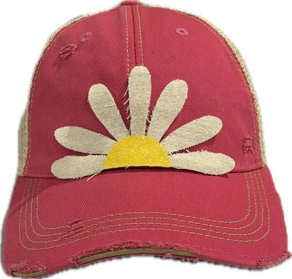 Daisy hat by BohoGroove featuring white daisy petals with a yellow glitter center on a pink vintage distressed snapback trucker hat.