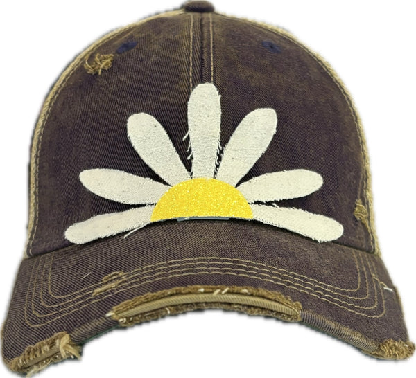 Daisy hat by BohoGroove featuring white daisy petals with a yellow glitter center on a purple vintage distressed snapback trucker hat.