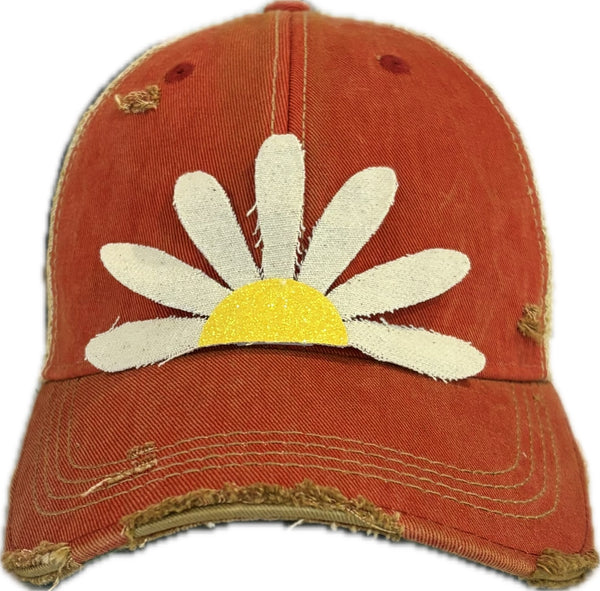 Daisy hat by BohoGroove featuring white daisy petals with a yellow glitter center on a red vintage distressed snapback trucker hat.
