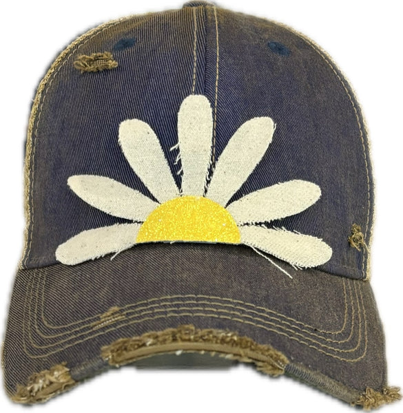 Daisy hat by BohoGroove featuring white daisy petals with a yellow glitter center on a royal blue vintage distressed snapback trucker hat.