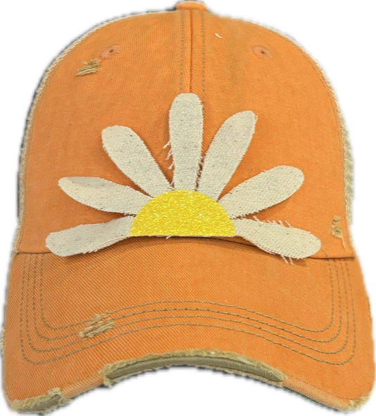Daisy hat by BohoGroove featuring white daisy petals with a yellow glitter center on a sherbet vintage distressed snapback trucker hat.