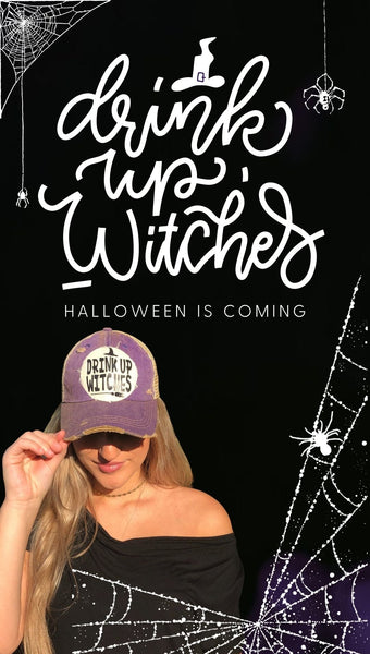 Blonde woman wearing a purple Drink Up Witches hat by BohoGroove with Drink Up Witches wording on a distressed off-white patch on a purple vintage distressed snapback, with Halloween Is Coming text and spider web graphics on a black background.