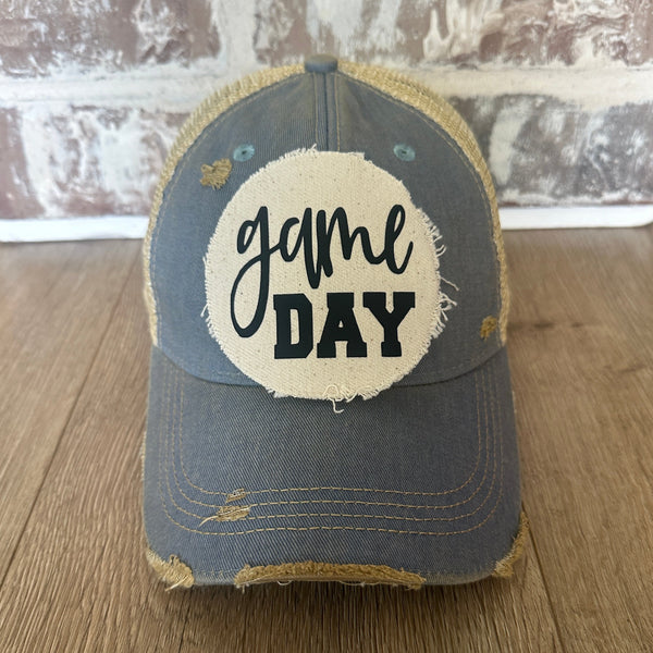 Game Day sports hat by BohoGroove with black Game Day lettering on distressed off-white patch on light blue vintage distressed snapback.