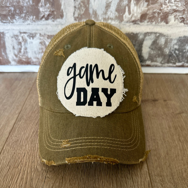 Game Day sports hat by BohoGroove with black Game Day lettering on distressed off-white patch on olive vintage distressed snapback.