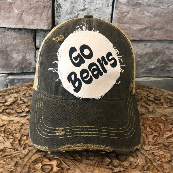 Go Bears hat by BohoGroove featuring black Go Bears lettering on a round cream frayed patch on a black vintage distressed snapback trucker hat.