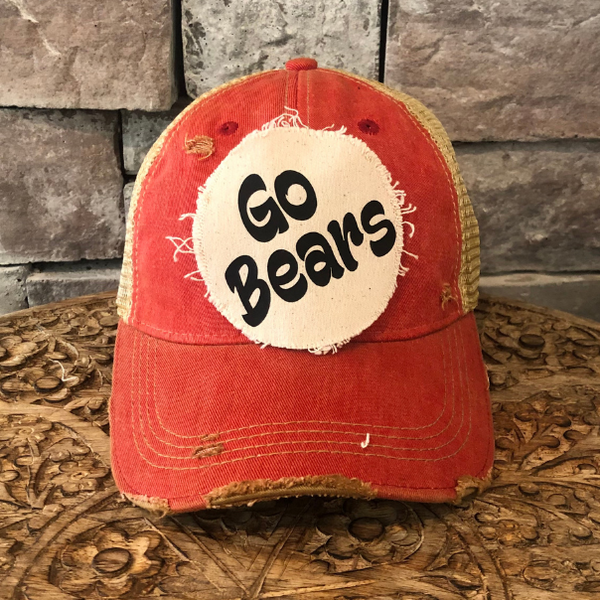 Go Bears hat by BohoGroove featuring black Go Bears lettering on a round cream frayed patch on a red vintage distressed snapback trucker hat.