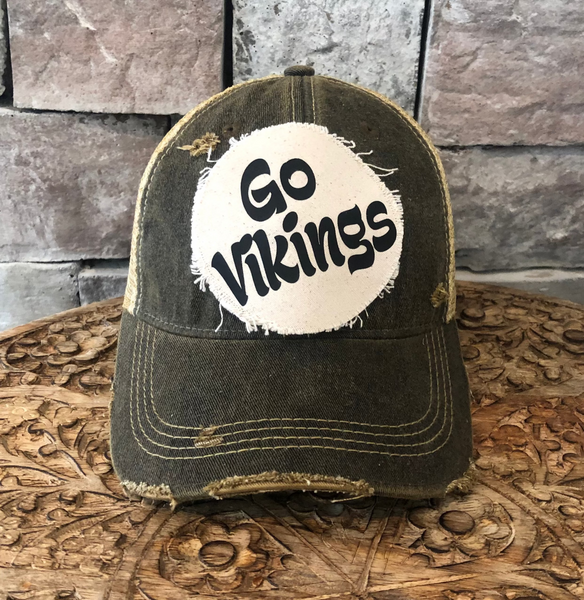 Go Vikings hat by BohoGroove featuring black Go Vikings lettering on a round cream frayed patch on a black vintage distressed snapback trucker hat.