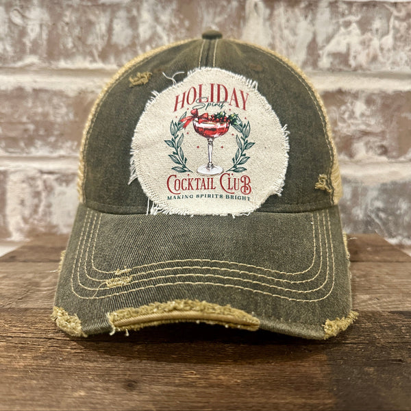 Holiday Cocktail Club hat by BohoGroove featuring a festive cocktail and Making Spirits Bright design on a Black vintage distressed snapback trucker hat.