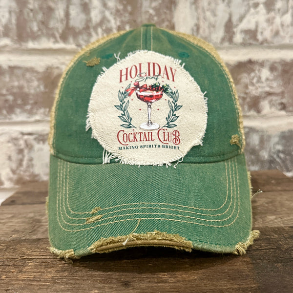 Holiday Cocktail Club hat by BohoGroove featuring a festive cocktail and Making Spirits Bright design on a Green vintage distressed snapback trucker hat.