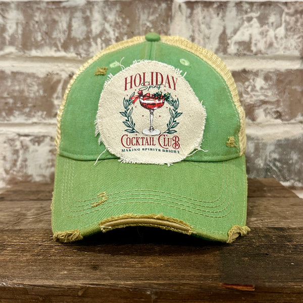 Holiday Cocktail Club hat by BohoGroove featuring a festive cocktail and Making Spirits Bright design on a Mint vintage distressed snapback trucker hat.
