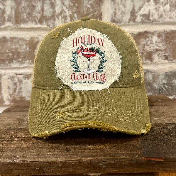 Holiday Cocktail Club hat by BohoGroove featuring a festive cocktail and Making Spirits Bright design on an Olive vintage distressed snapback trucker hat.