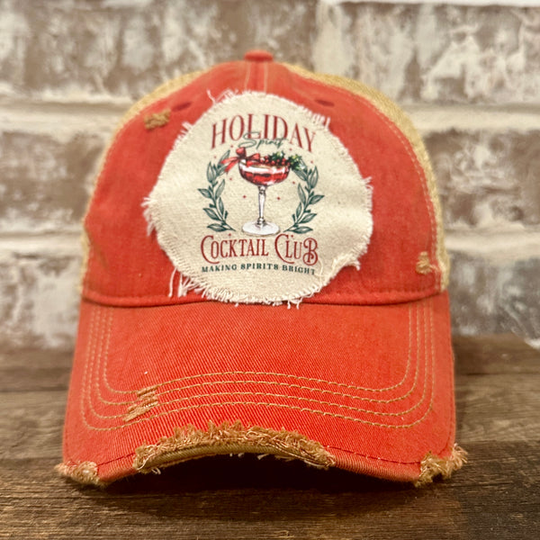 Holiday Cocktail Club hat by BohoGroove featuring a festive cocktail and Making Spirits Bright design on a Red vintage distressed snapback trucker hat.