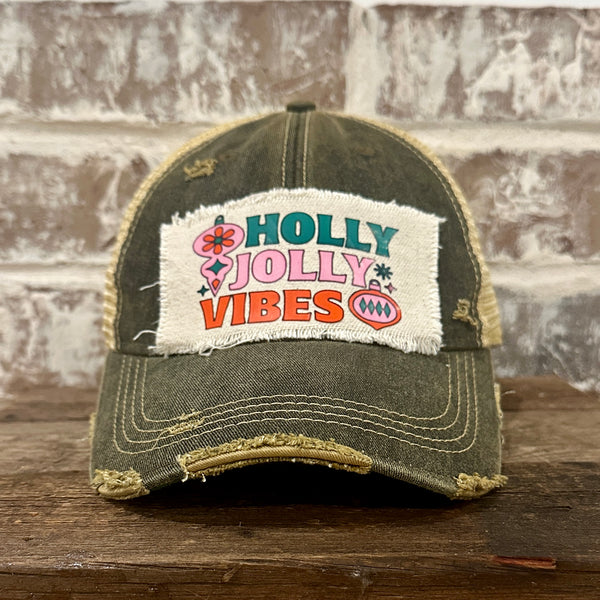 Holly Jolly Vibes hat by BohoGroove featuring a colorful retro Christmas design on a black vintage distressed snapback trucker hat.