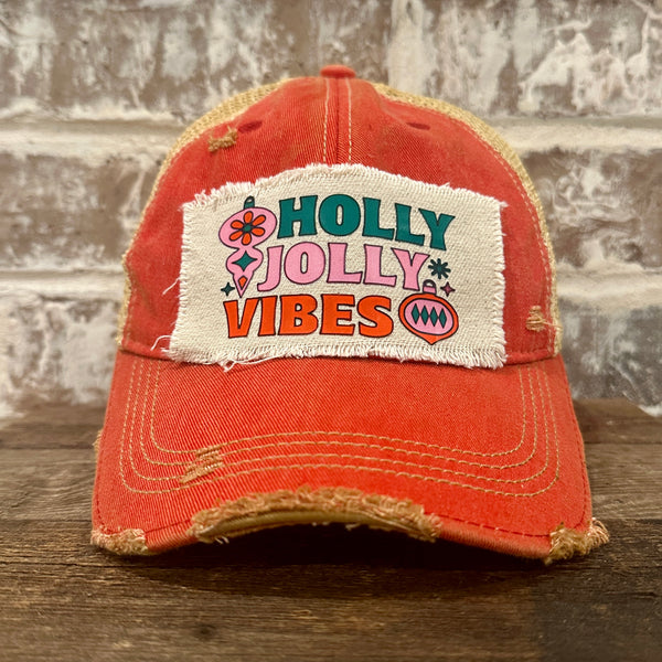 Holly Jolly Vibes hat by BohoGroove featuring a colorful retro Christmas design on a red vintage distressed snapback trucker hat.