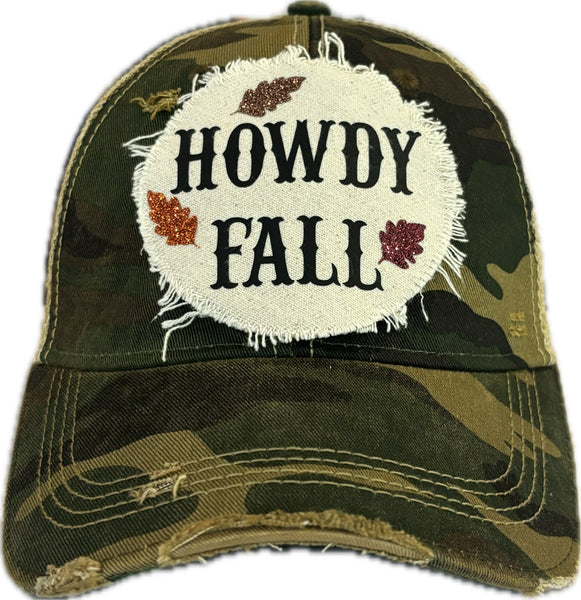 Howdy Fall hat by BohoGroove with black HOWDY FALL lettering and glitter fall leaves on a camo vintage distressed snapback.