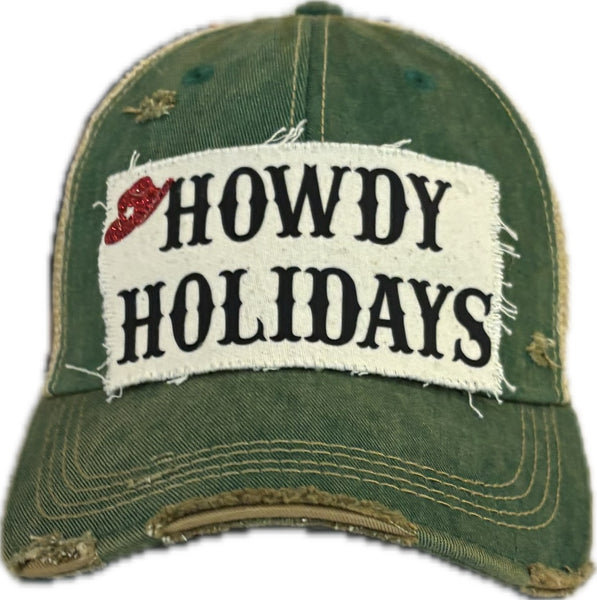 Howdy Holidays Cowboy Hat by BohoGroove with black Howdy Holidays lettering and a red glitter cowboy hat graphic on a distressed off-white custom patch on a green vintage distressed snapback.