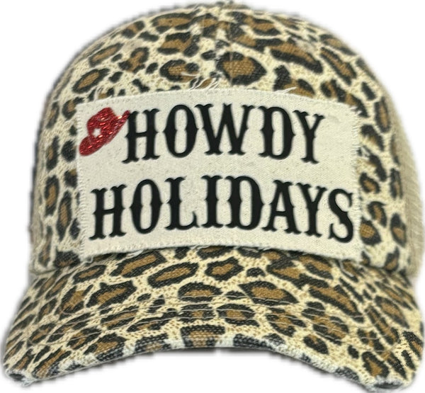 Howdy Holidays Cowboy Hat by BohoGroove with black Howdy Holidays lettering and a red glitter cowboy hat graphic on a distressed off-white custom patch on a leopard vintage distressed snapback.