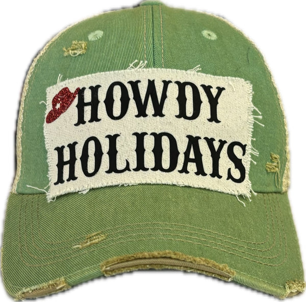 Howdy Holidays Cowboy Hat by BohoGroove with black Howdy Holidays lettering and a red glitter cowboy hat graphic on a distressed off-white custom patch on a mint vintage distressed snapback.