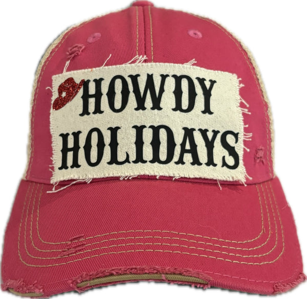 Howdy Holidays Cowboy Hat by BohoGroove with black Howdy Holidays lettering and a red glitter cowboy hat graphic on a distressed off-white custom patch on a pink vintage distressed snapback.