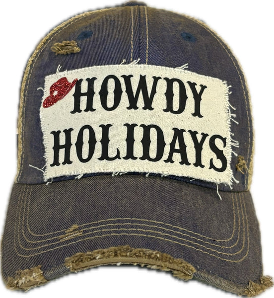 Howdy Holidays Cowboy Hat by BohoGroove with black Howdy Holidays lettering and a red glitter cowboy hat graphic on a distressed off-white custom patch on a royal blue vintage distressed snapback.