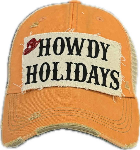 Howdy Holidays Cowboy Hat by BohoGroove with black Howdy Holidays lettering and a red glitter cowboy hat graphic on a distressed off-white custom patch on a sherbet vintage distressed snapback.