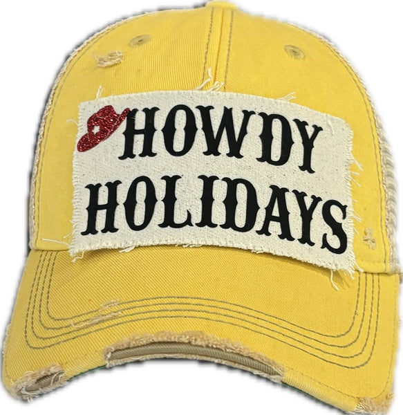 Howdy Holidays Cowboy Hat by BohoGroove with black Howdy Holidays lettering and a red glitter cowboy hat graphic on a distressed off-white custom patch on a yellow vintage distressed snapback.