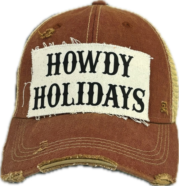 Howdy Holidays hat by BohoGroove with black Howdy Holidays lettering on a distressed off-white custom patch on a brick red vintage distressed snapback.