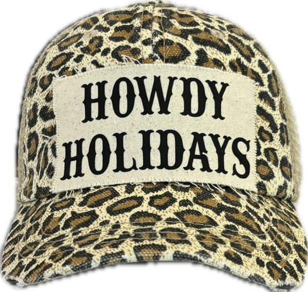 Howdy Holidays hat by BohoGroove with black Howdy Holidays lettering on a distressed off-white custom patch on a leopard vintage distressed snapback.