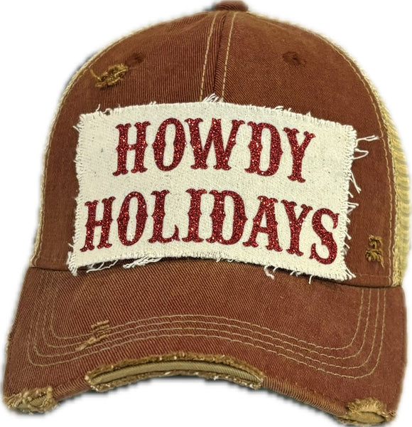 Howdy Holidays Red Glitter hat by BohoGroove with red glitter Howdy Holidays lettering on a distressed off-white custom patch on a brick red vintage distressed snapback.