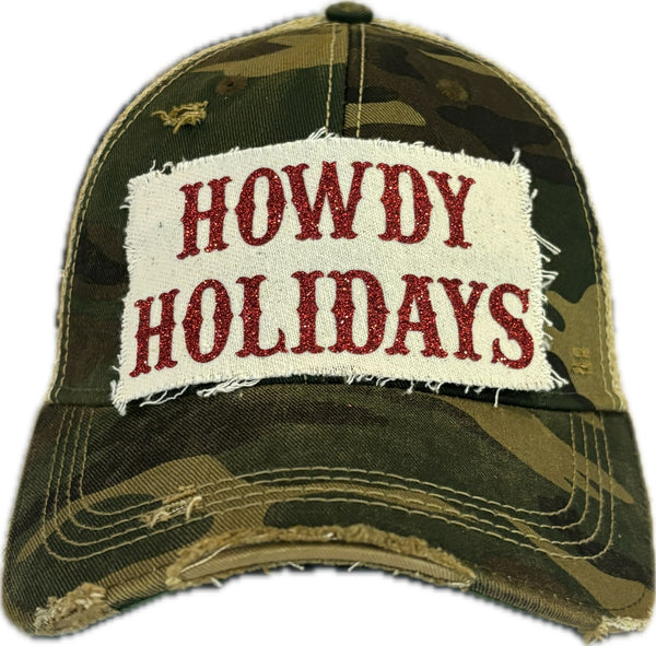 Howdy Holidays Red Glitter hat by BohoGroove with red glitter Howdy Holidays lettering on a distressed off-white custom patch on a camo vintage distressed snapback.