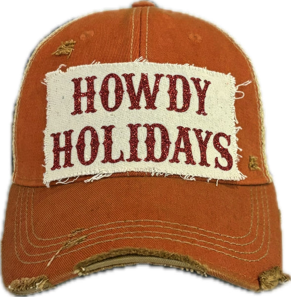 Howdy Holidays Red Glitter hat by BohoGroove with red glitter Howdy Holidays lettering on a distressed off-white custom patch on an orange vintage distressed snapback.