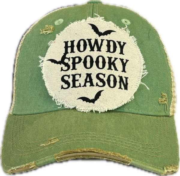 Howdy Spooky Season hat by BohoGroove with black wording and bat graphics on a distressed off-white patch on a mint vintage distressed snapback trucker hat.