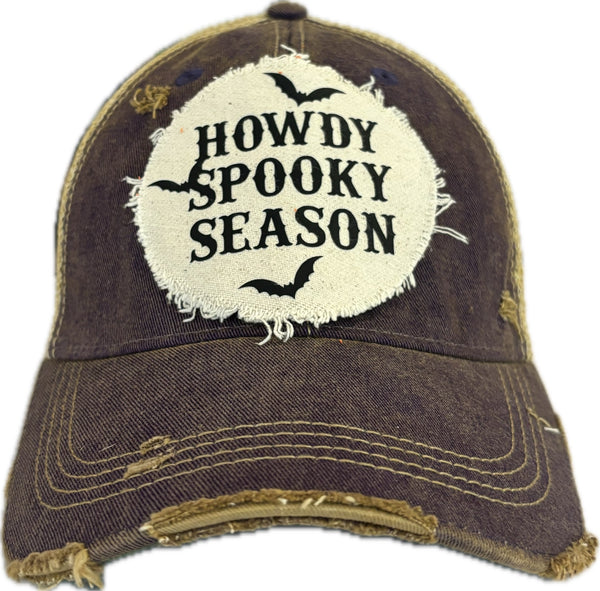 Howdy Spooky Season hat by BohoGroove with black wording and bat graphics on a distressed off-white patch on a navy blue vintage distressed snapback trucker hat.