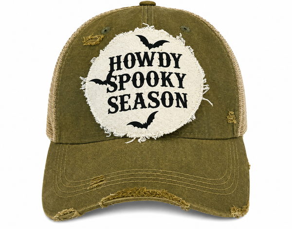 Howdy Spooky Season hat by BohoGroove with black wording and bat graphics on a distressed off-white patch on an olive vintage distressed snapback trucker hat.