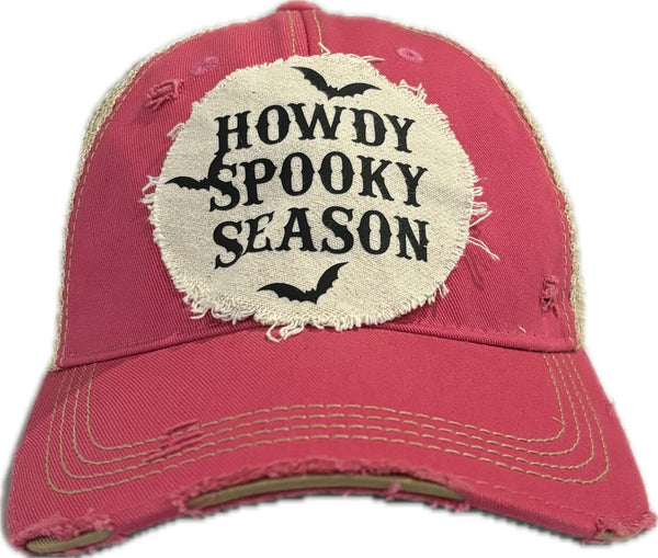 Howdy Spooky Season hat by BohoGroove with black wording and bat graphics on a distressed off-white patch on a pink vintage distressed snapback trucker hat.
