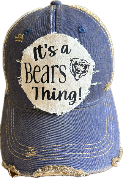 It's a Bears Thing hat by BohoGroove featuring black lettering and a bear graphic on a round cream frayed patch on a Royal blue vintage distressed snapback trucker hat.