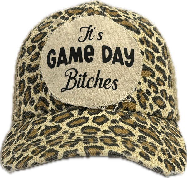 It's Game Day Bitches hat by BohoGroove featuring black It's Game Day Bitches lettering on a leopard vintage distressed snapback hat