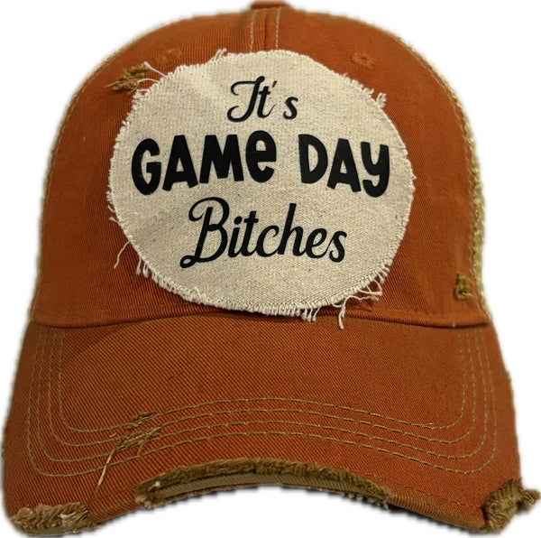 It's Game Day Bitches hat by BohoGroove featuring black It's Game Day Bitches lettering on an orange vintage distressed snapback hat