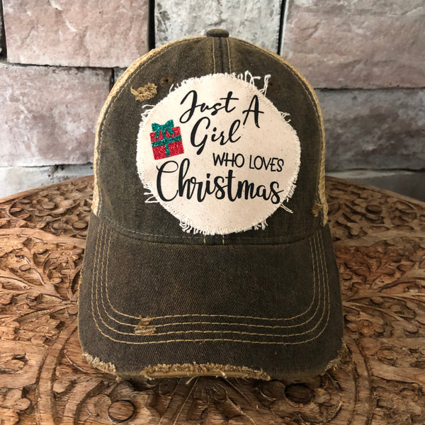 Black cap that says just a girl who loves Christmas