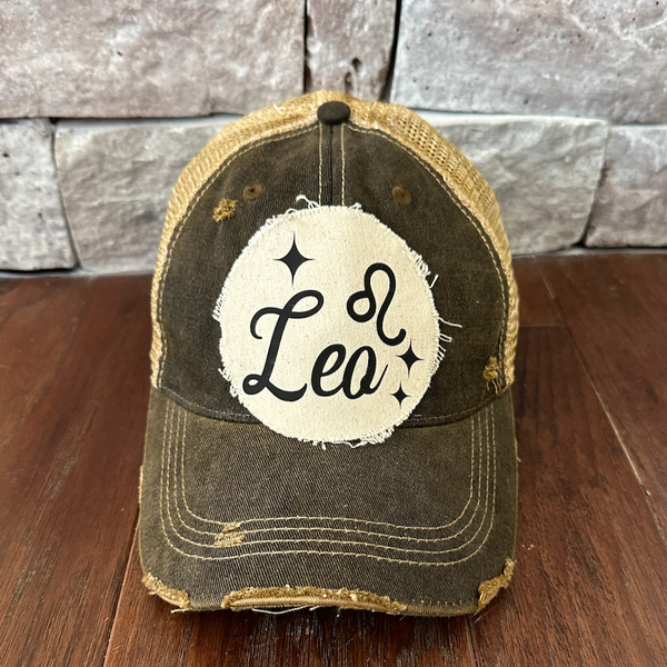 Leo hat by BohoGroove with black Leo lettering and constellation graphic on a distressed off-white custom patch on a black vintage distressed snapback.